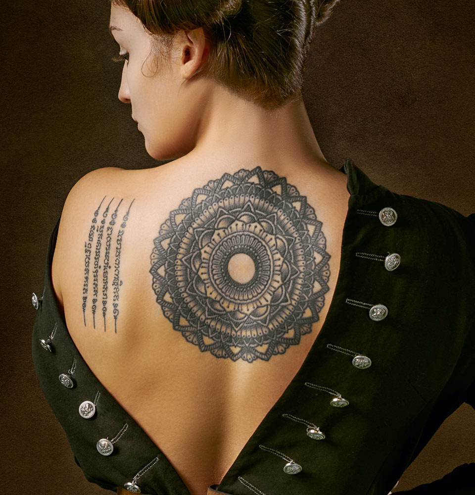 Woman with Geometric Tattoo on Back Woman with Geometric Tattoo on Back