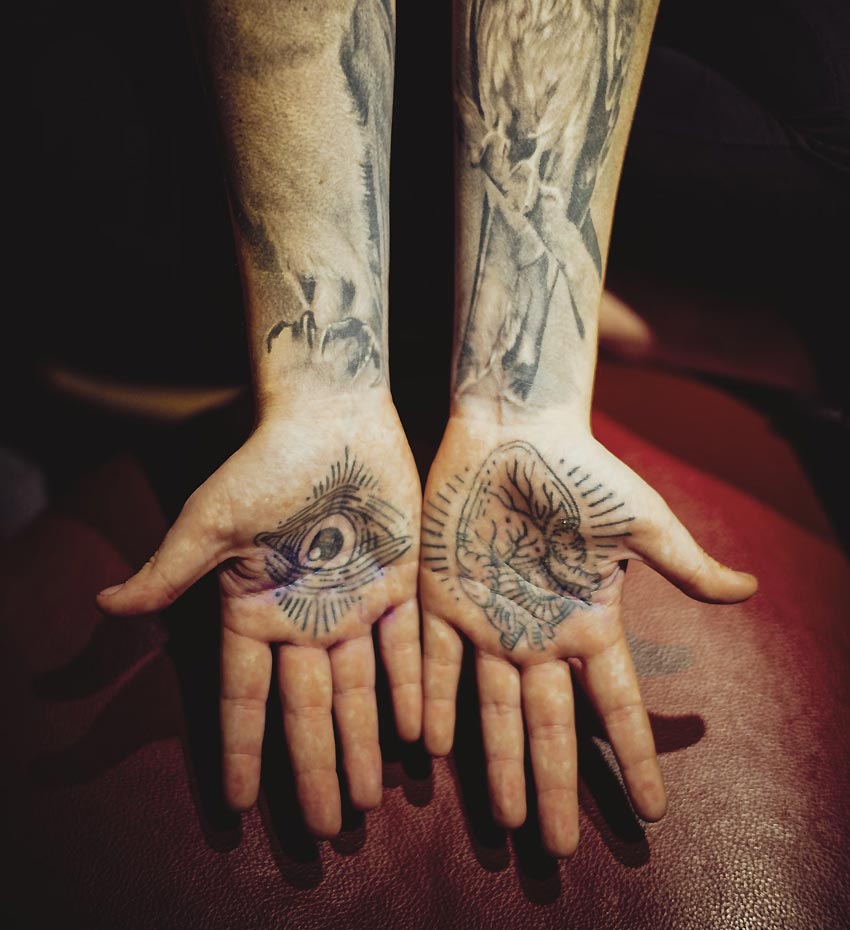 Person with Tattoos on Hands and Arms Person with Tattoos on hands and arms